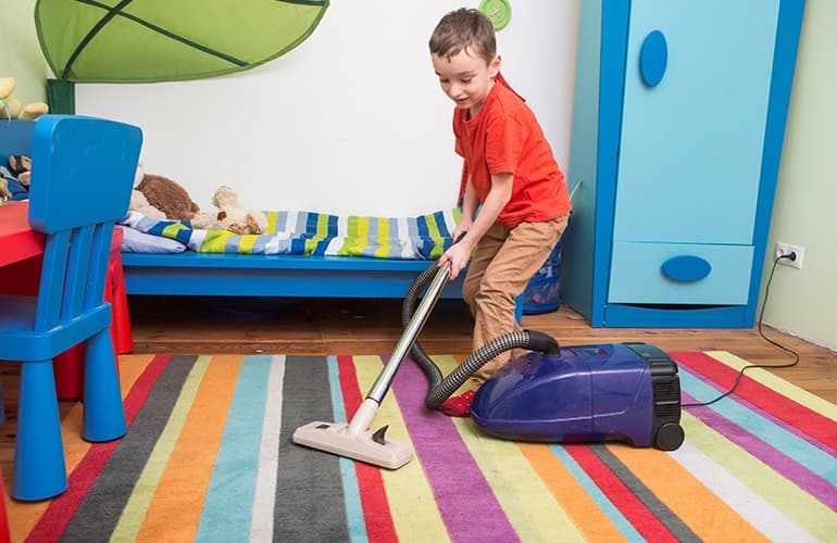 Kid Vacuuming a Capet