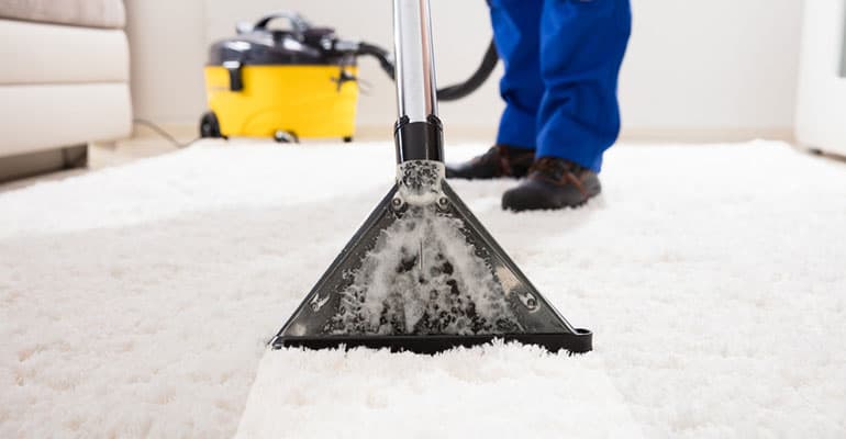 Man Cleaning Carpet